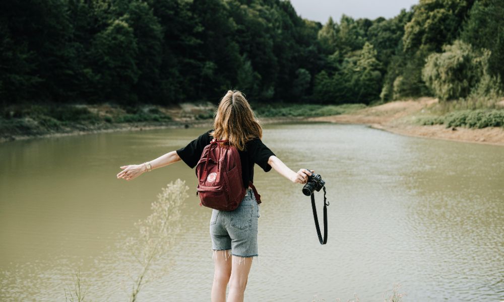 Young woman on a budget-friendly solo travel adventure 2025