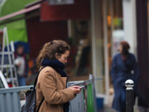 Solo woman walking safely on a city street